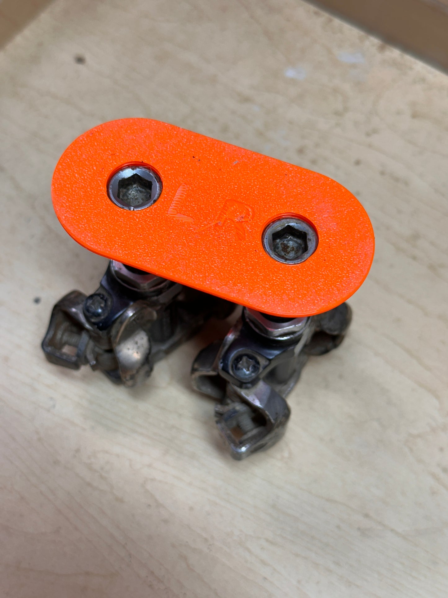 Clipless pedals in wide base parallel holder showing base.