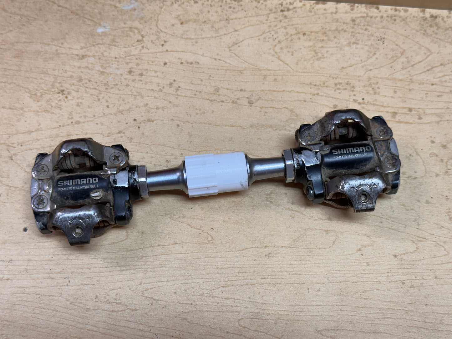 Clipless pedals held in inline holder