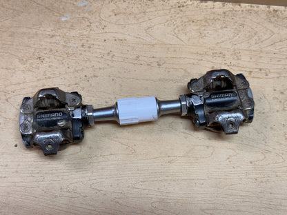 Clipless pedals held in inline holder