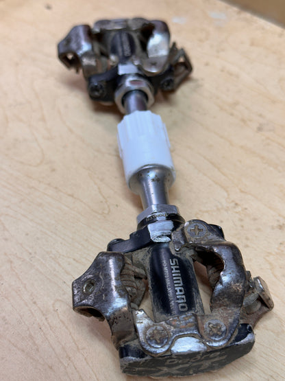 Clipless pedals installed in inline holder